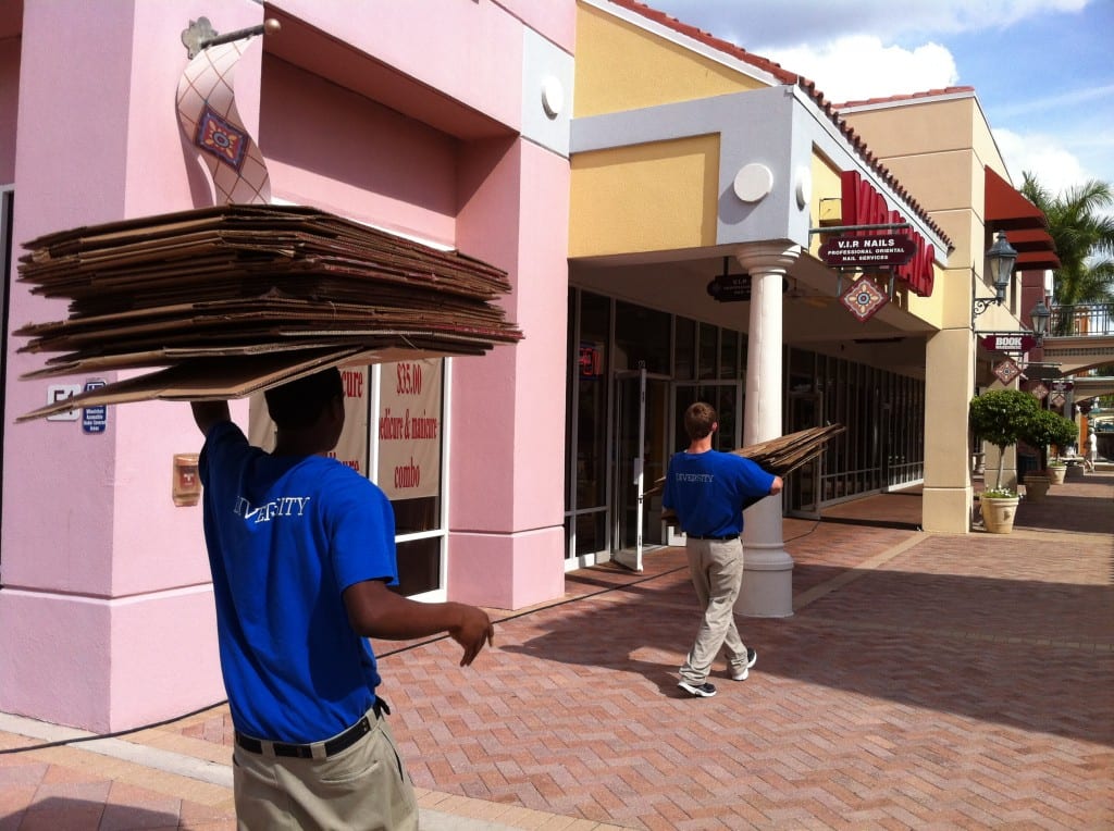 Students from AMI-Kids, Ft. Myers Beach volunteered to help pack up the books. 