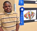 Fiery “Love” Burns Up the Competition and Wins First Place in “Power of the Word” Art Contest